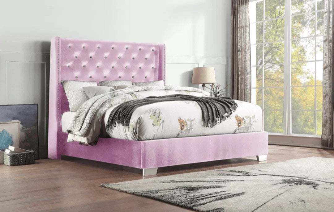 Purple tufted velvet bed with white patterned bedding in a modern bedroom