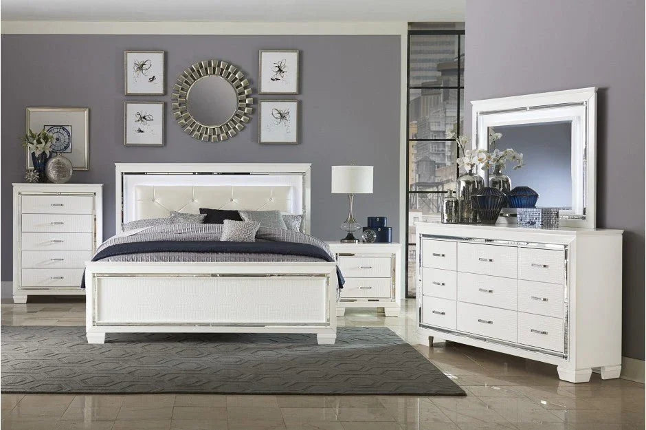 Modern white bedroom set with mirrored accents including bed, dresser, and nightstand.