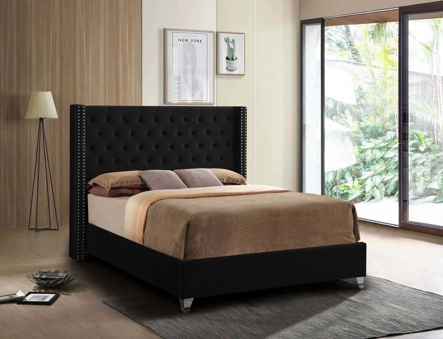 Black tufted upholstered platform bed with brown bedding in a modern bedroom