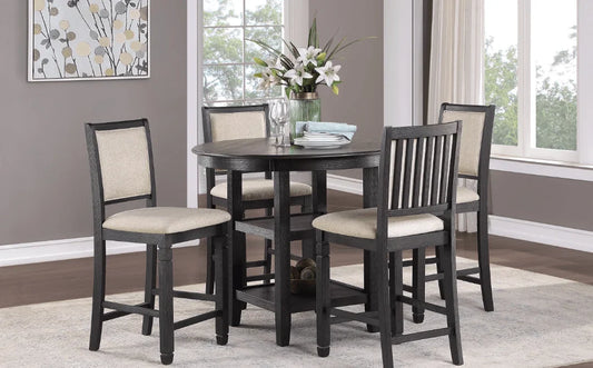 Black wood counter-height dining set with four beige upholstered chairs around a round table.