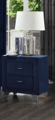 Navy blue upholstered nightstand with two drawers and a silver table lamp