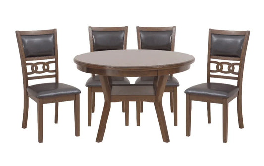 Round wooden dining table set with four dark brown leather chairs